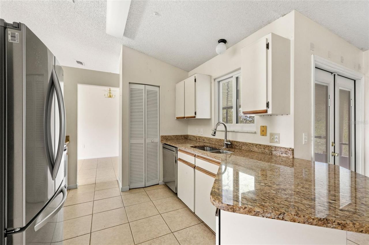 Photo 2 of 20: Kitchen with stainless steel appliances and granite counters.