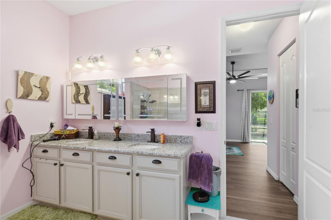 Photo 20 of 20: Main bath with double sinks and granite countertops.
