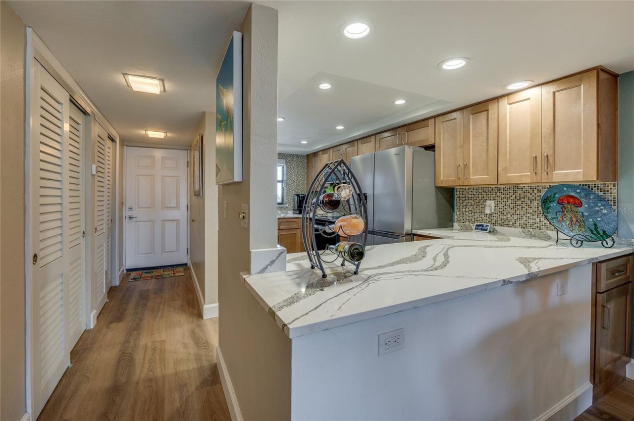 Photo 8 of 20: View from the kitchen showcasing additional cabinetry, and smooth transition into the main living areas.