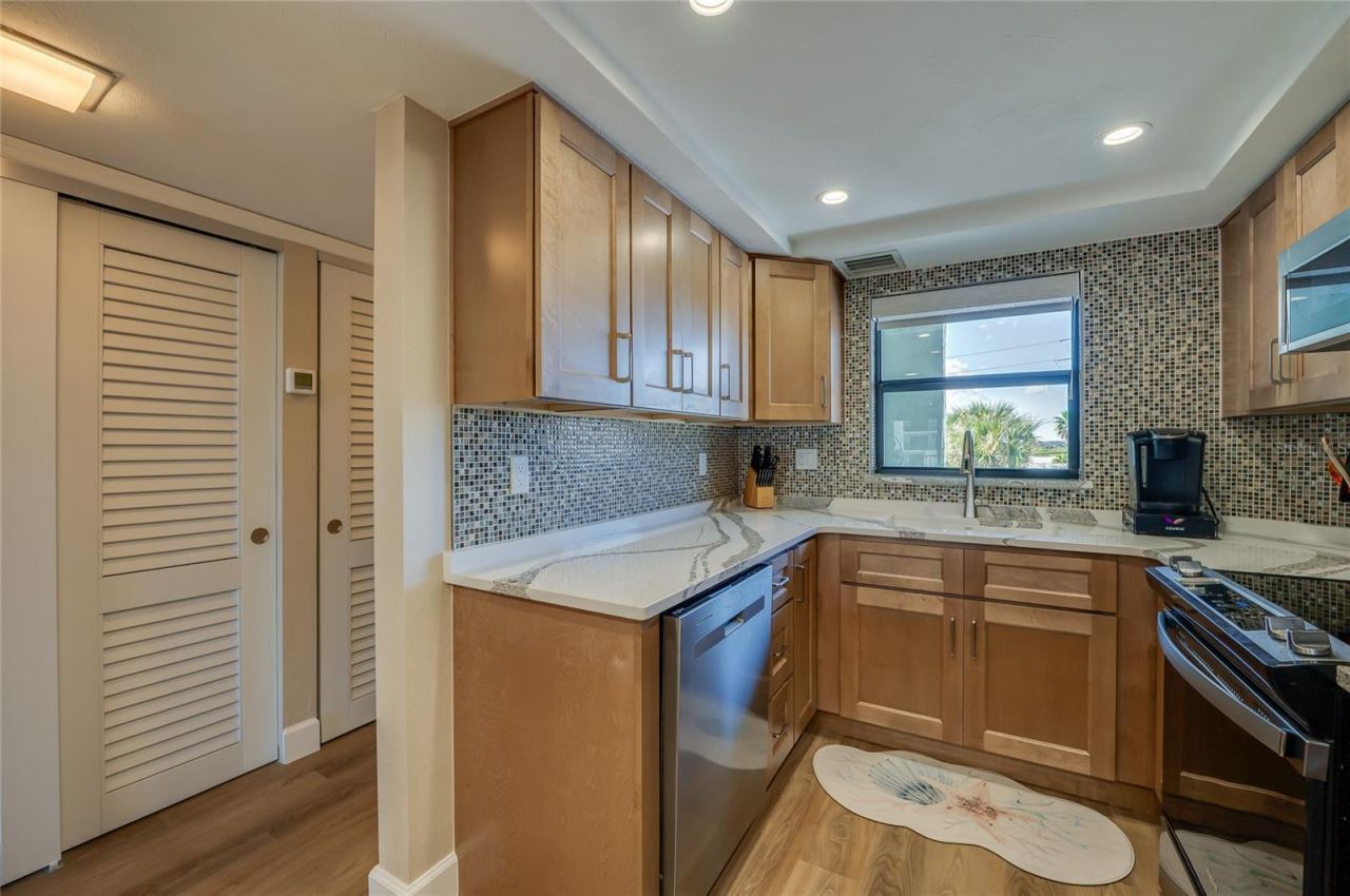 Photo 6 of 20: Another view of the thoughtfully designed kitchen highlighting generous counter space, modern finishes, and a functional layout ideal for everyday use.