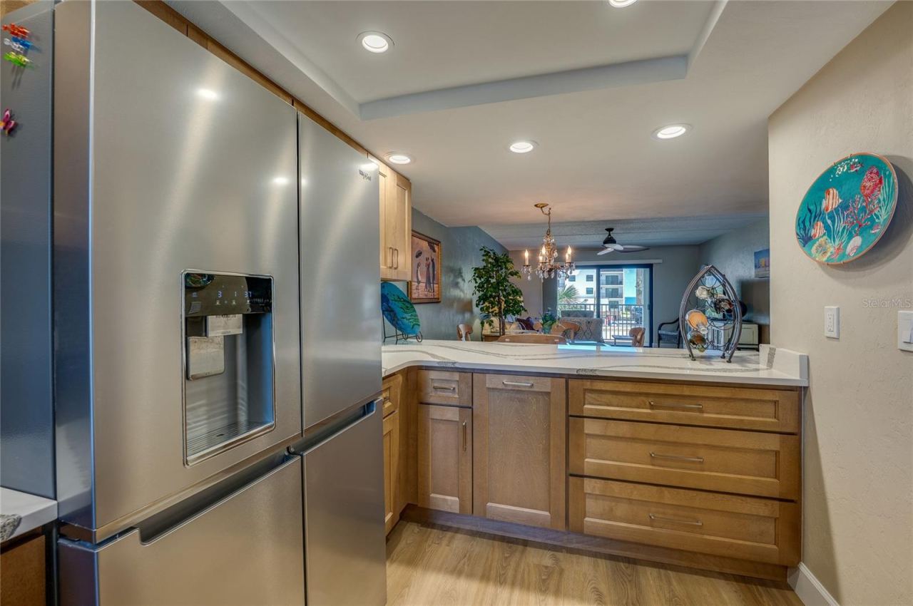 Photo 7 of 20: Open-concept kitchen that flows seamlessly into the living and dining areas, creating a welcoming space for relaxing or entertaining.