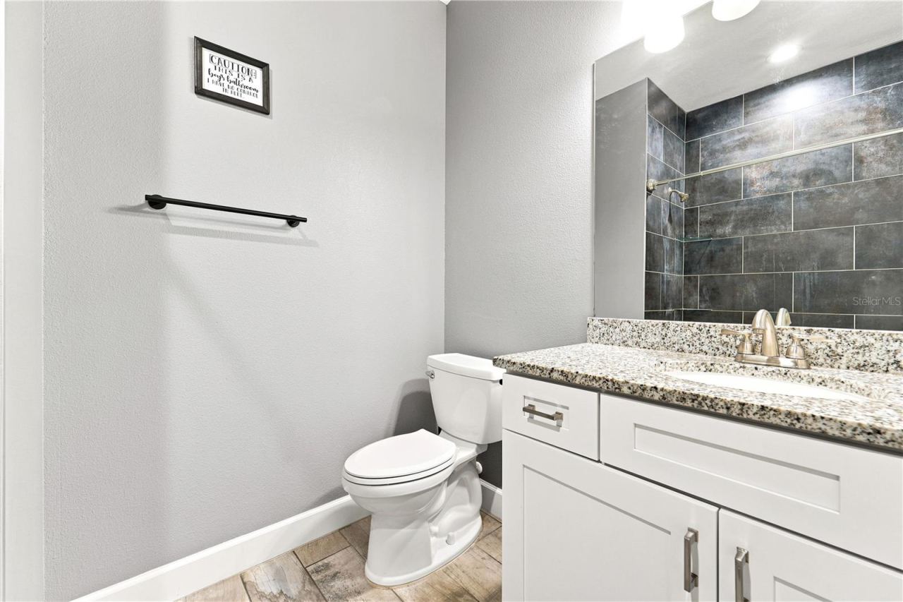 Photo 19 of 20: Guest Bathroom- Mirror reflecting shower wall adjacent to the vanity.