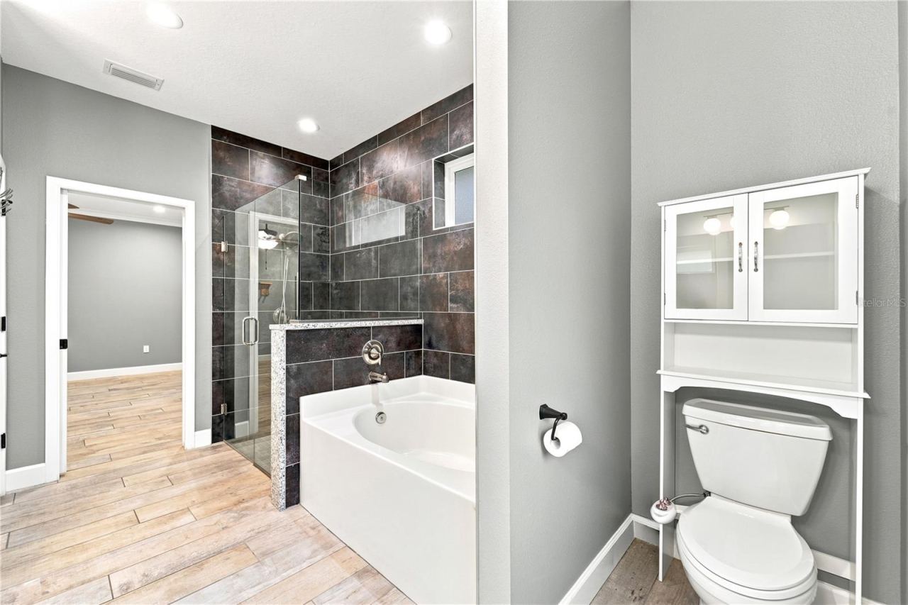 Photo 8 of 20: Primary Bathroom with a garden tub and walk in shower.