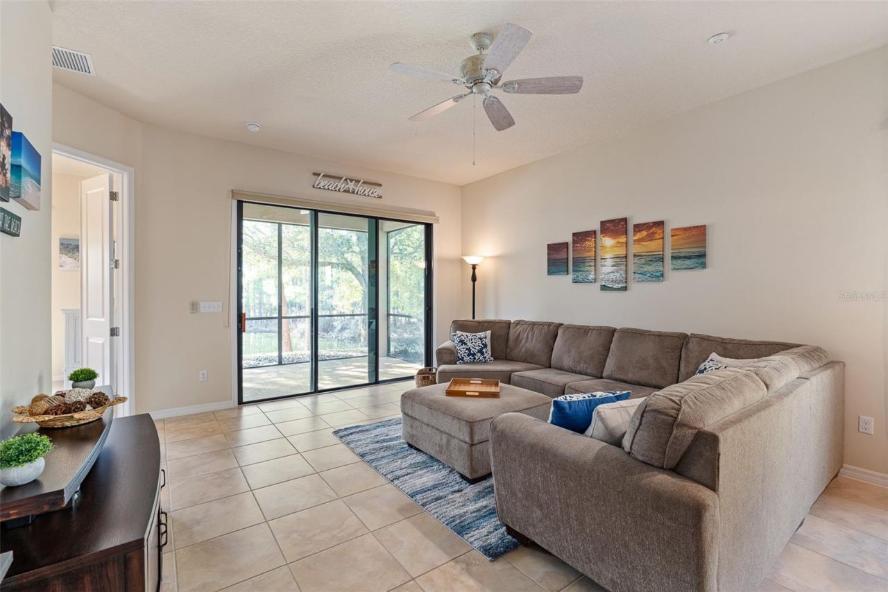 Photo 12 of 20: Family Living Room w/Triple Sliders to Lanai