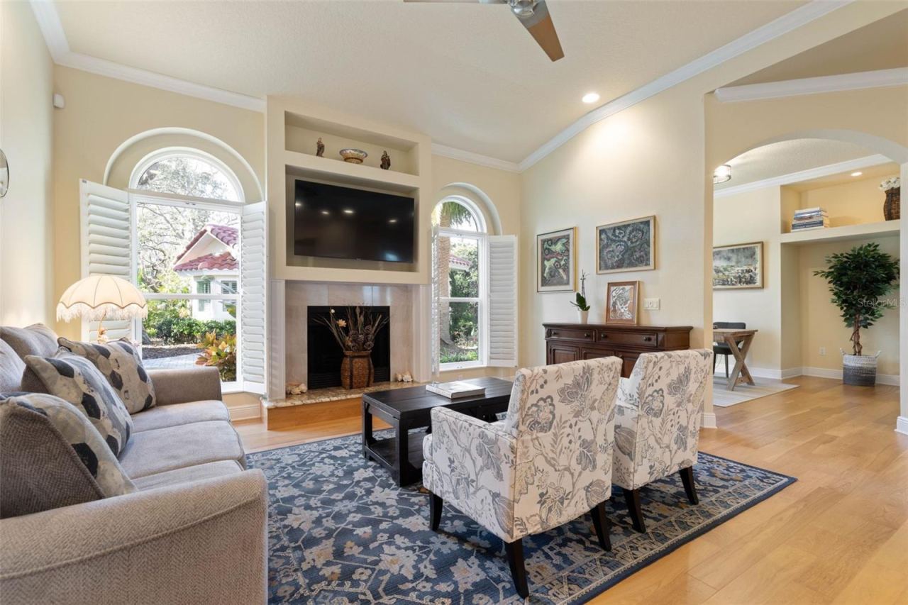 Photo 12 of 20: Family room with wood burning fireplace