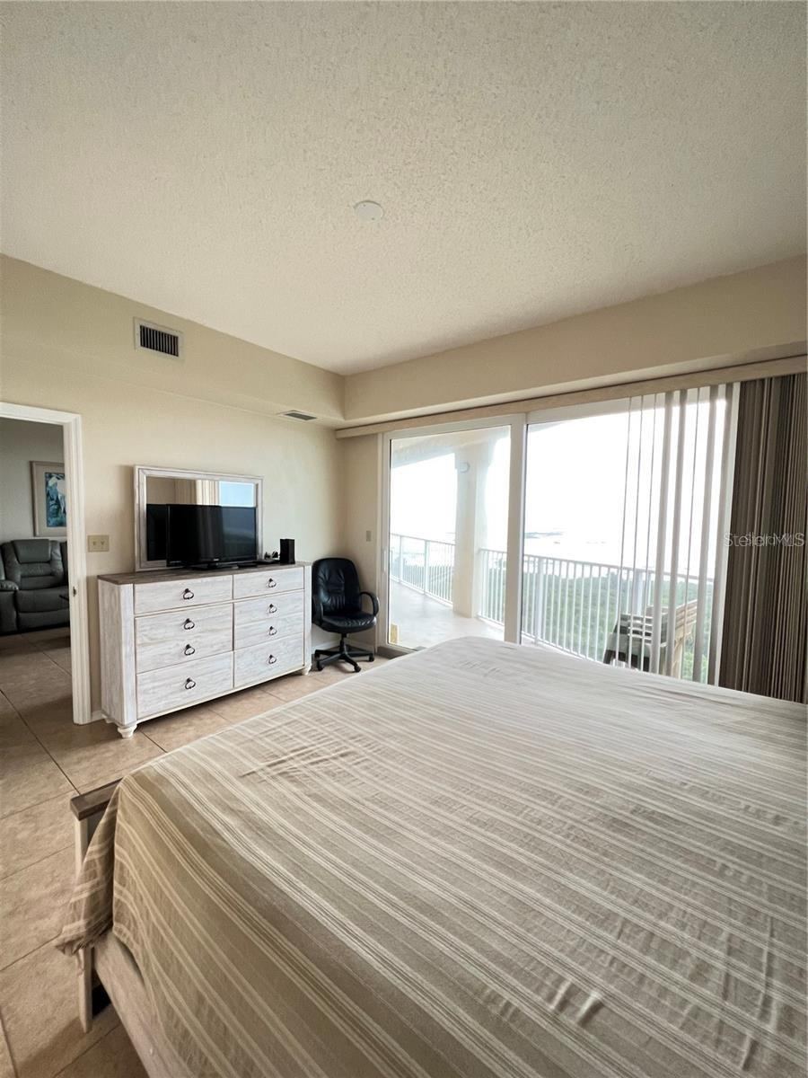 Photo 12 of 20: rimary Bedroom-King bed-sliders to balcony. Ensuite bathroom