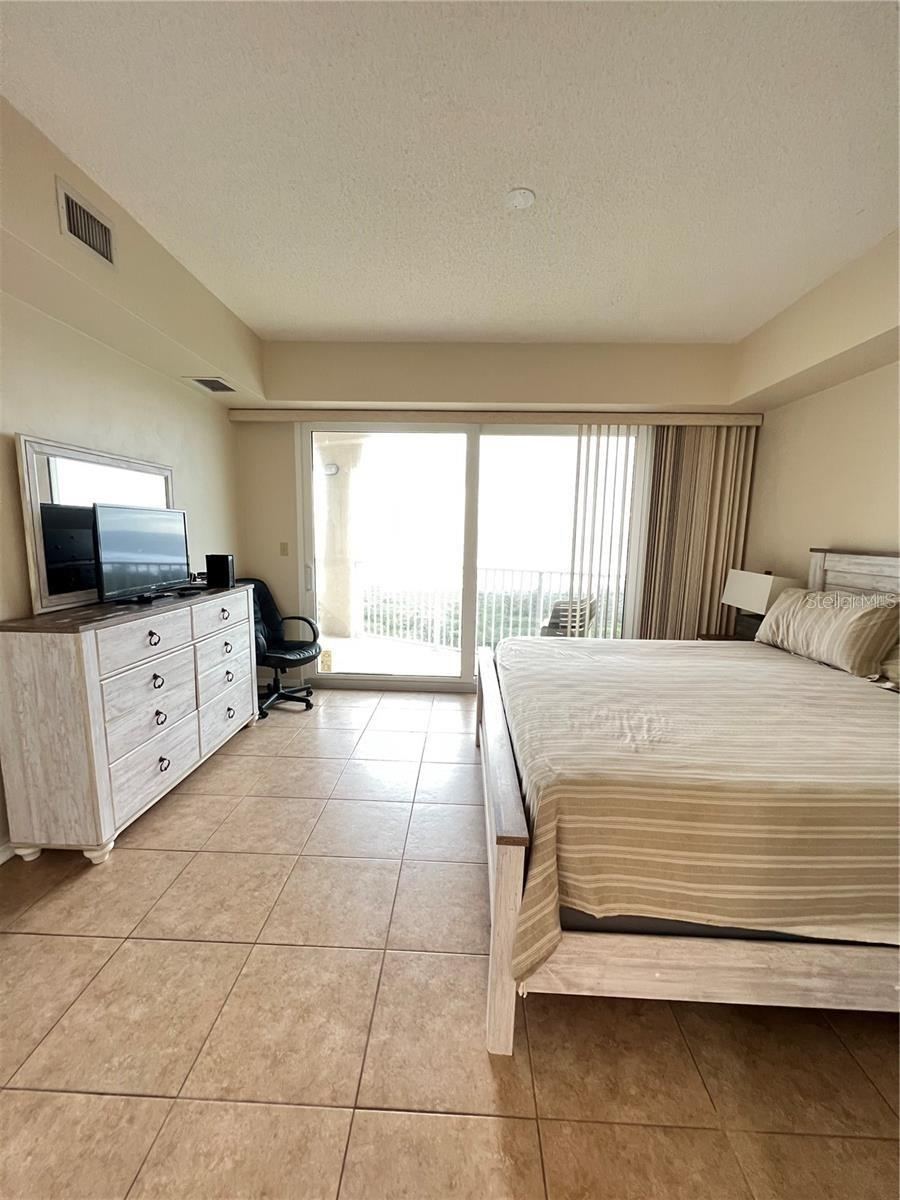 Photo 14 of 20: Primary Bedroom-King bed-sliders to balcony, two walk-in closets. Ensuite bathroom