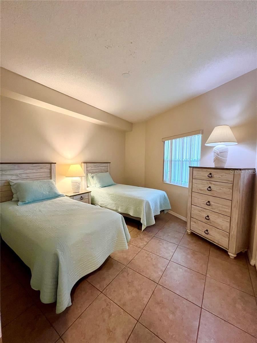 Photo 18 of 20: Second bedroom with twin beds and large window
