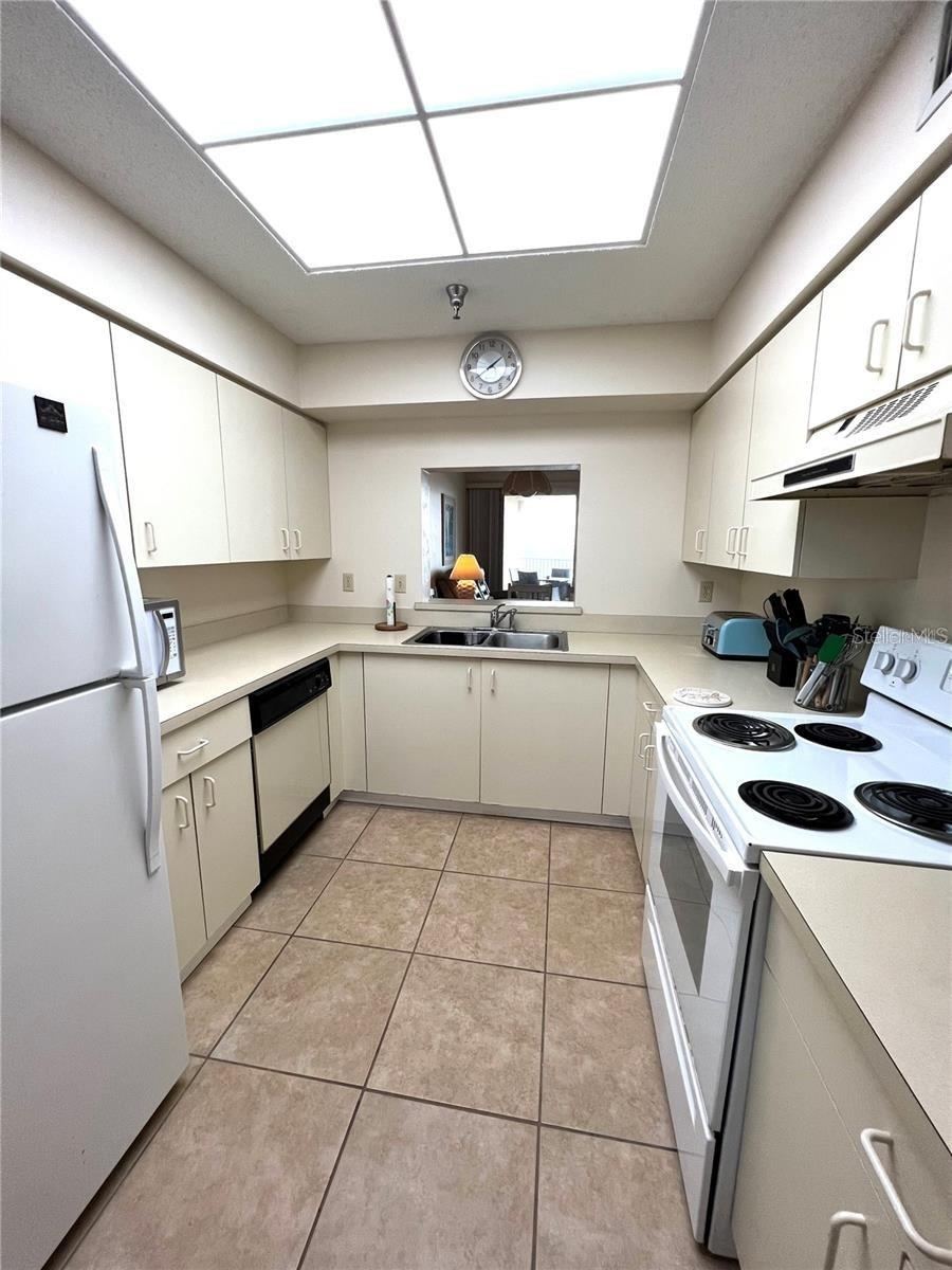 Photo 7 of 20: Kitchen with pass through giving views to Balcony