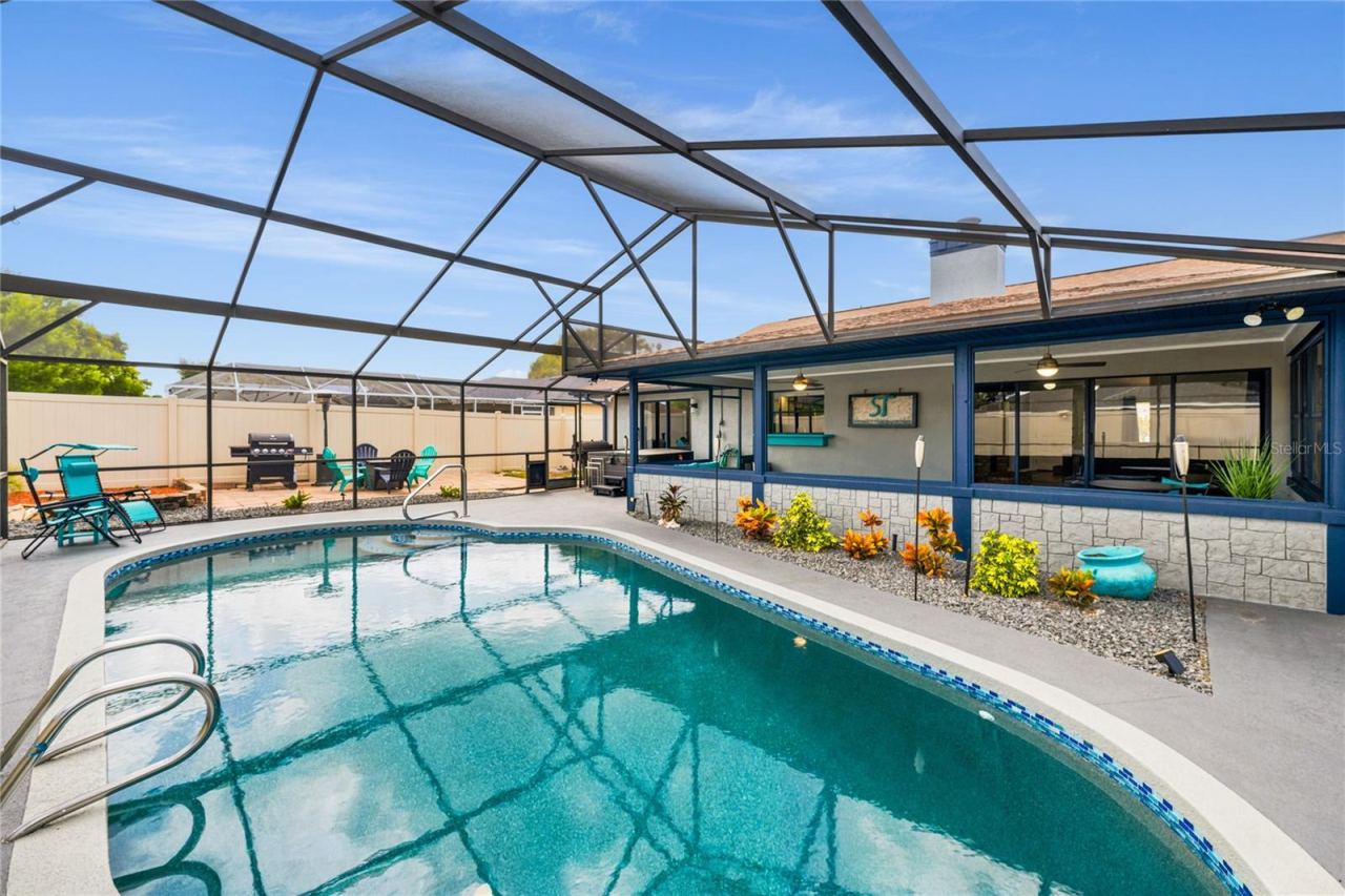 Photo 2 of 20: Resurfaced In-Ground Pool with Large Screen Cage