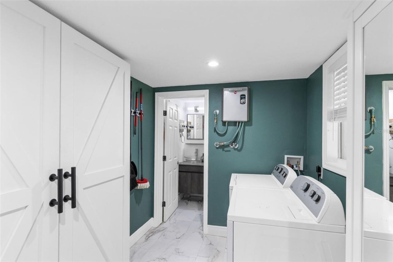 Photo 20 of 20: Oversized Laundry room with storage cabinets