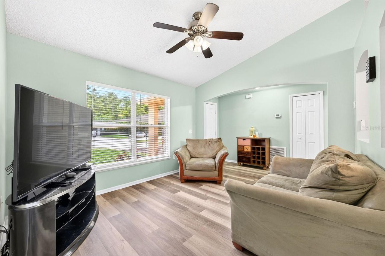 Photo 7 of 20: Foyer opens up into a versatile formal living room.