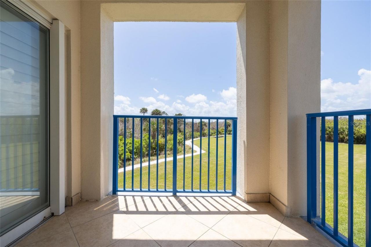 Photo 3 of 20: Rear balcony views of nature trail & palm trees