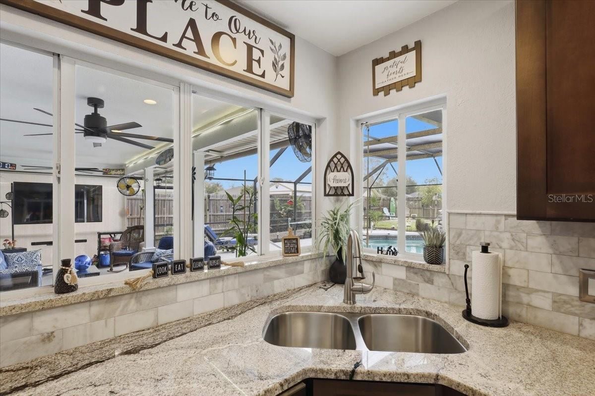 Photo 11 of 20: Kitchen sink looking out into the pool area