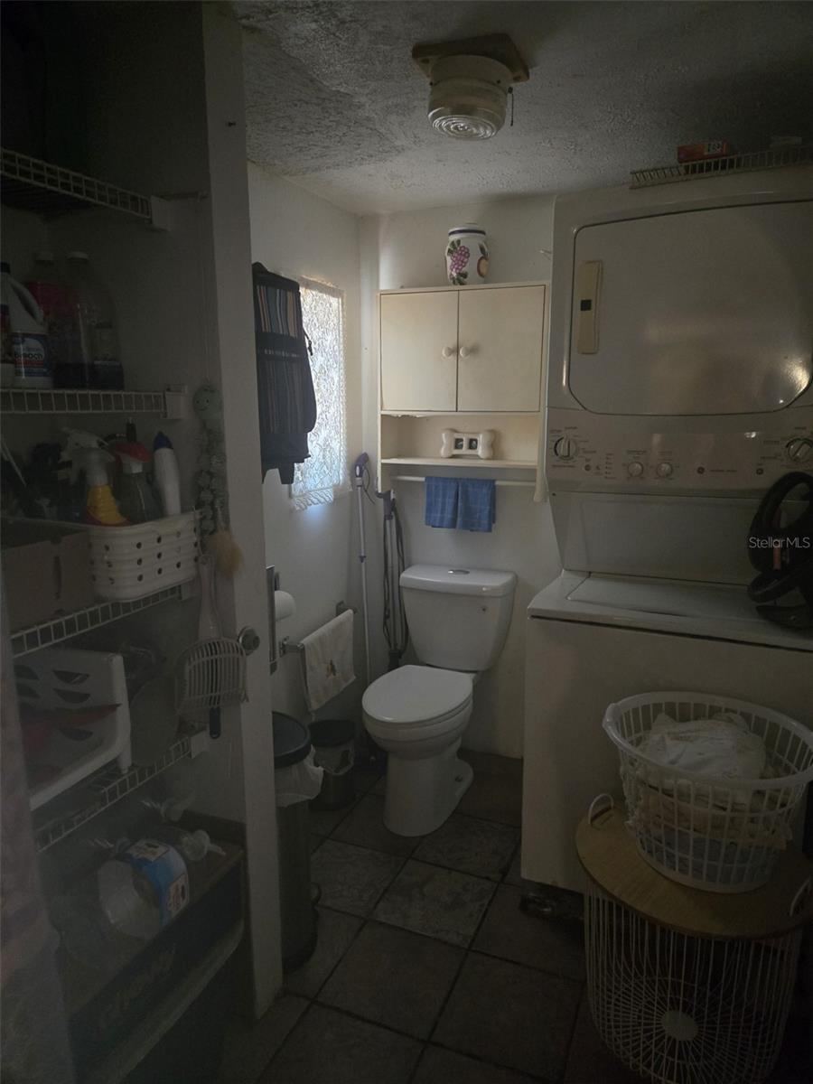 Photo 7 of 8: Half bath with washer/dryer