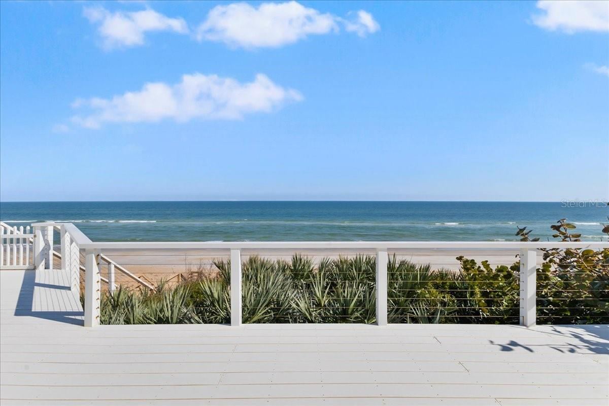 Photo 7 of 20: Stairs off east deck leading to the beach (2nd floor)