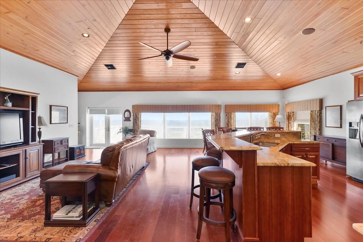 Photo 9 of 20: Second floor living room/dining area and kitchen.