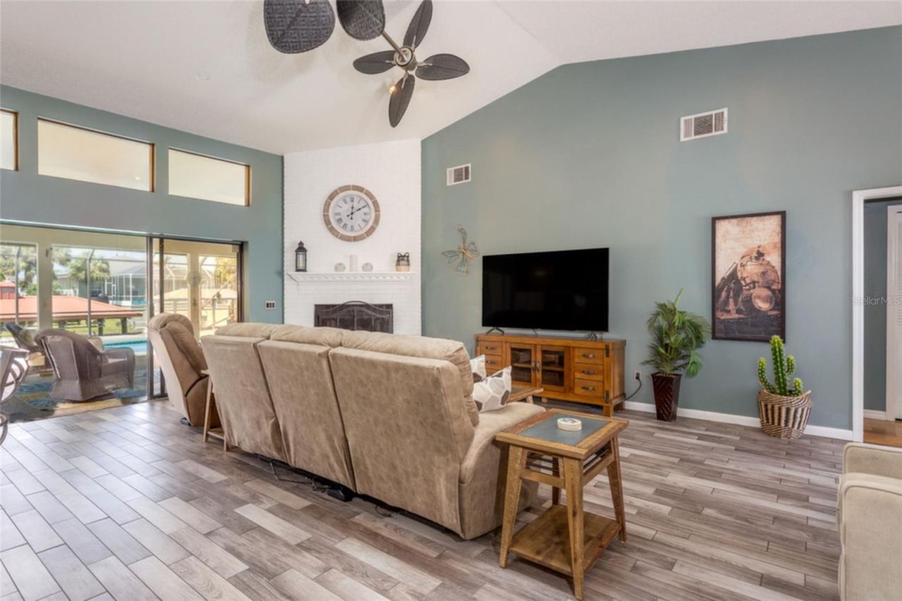 Photo 7 of 20: Living room with 3 sliders that ead to Screened in Lanai.