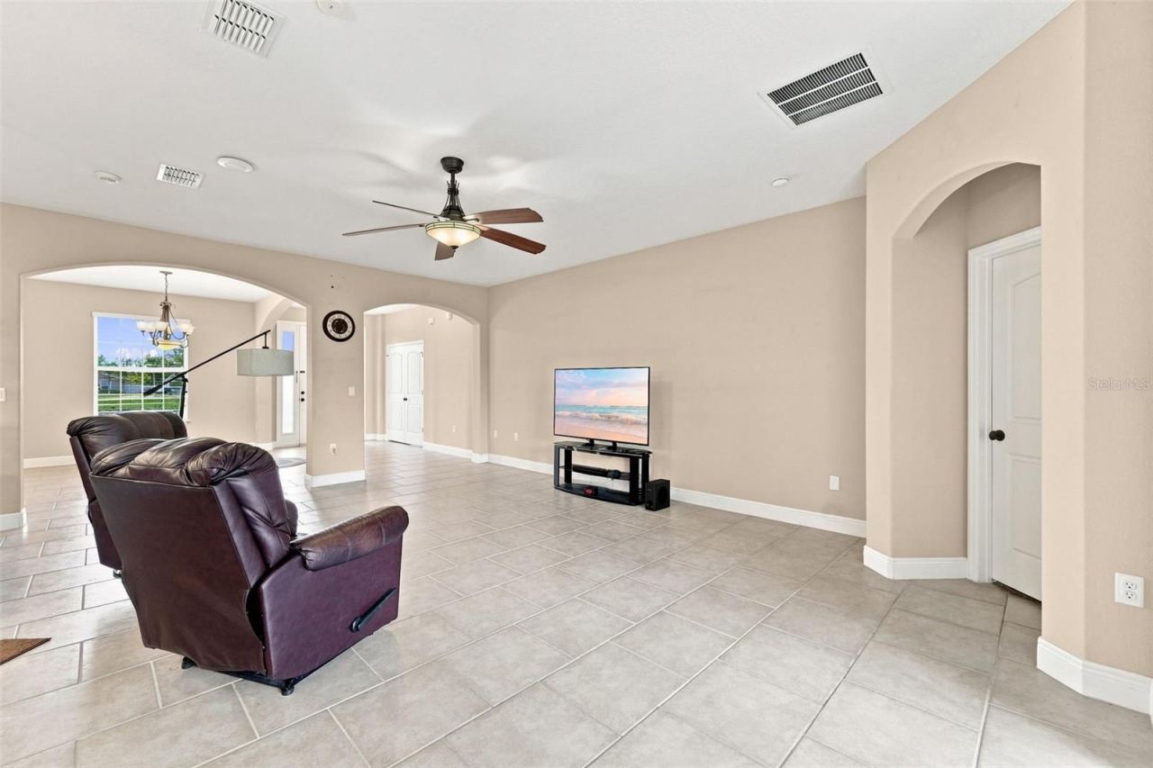 Photo 12 of 20: Living area towards front entrance and dining area.