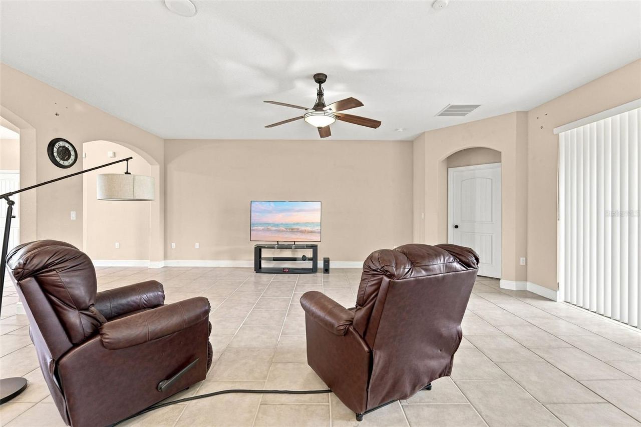 Photo 14 of 20: View of living area from kitchen. Lanai entrance at right.