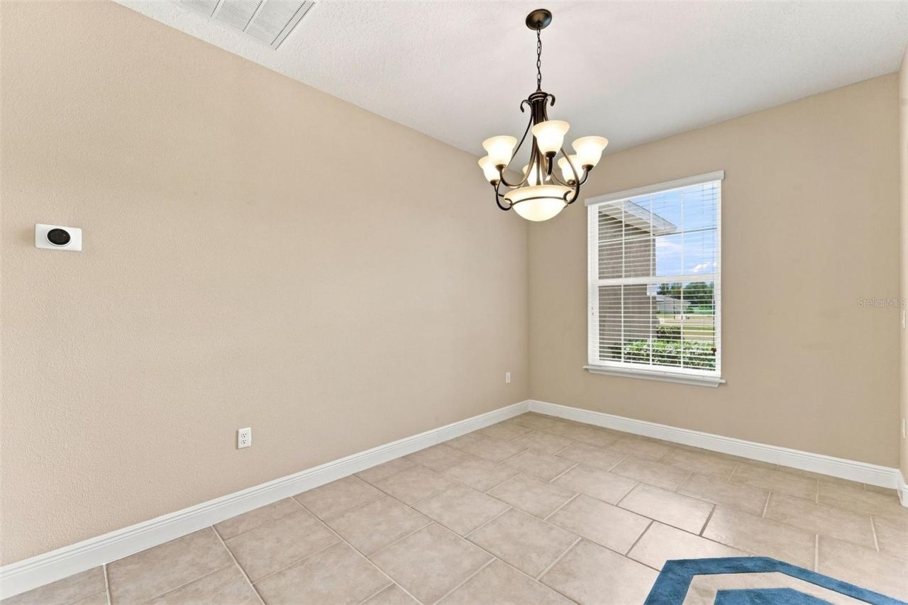 Photo 11 of 20: Dining room with Nest thermostat energy-efficient climate control.