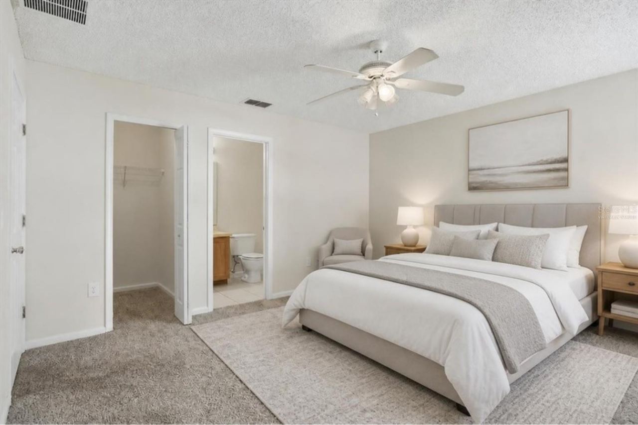 Photo 6 of 20: Virtually staged - primary bedroom with walk-in closet and bath
