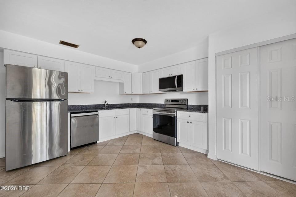 Photo 4 of 10: Kitchen with Stainless Appliances