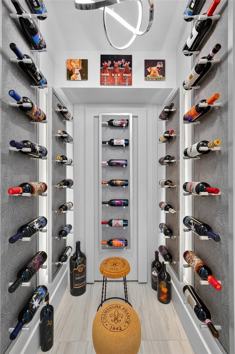Photo 7 of 20: Now this is a wine room. Custom illuminated bottle displays transform this dedicated space into something that feels as much like an art installation as wine storage.