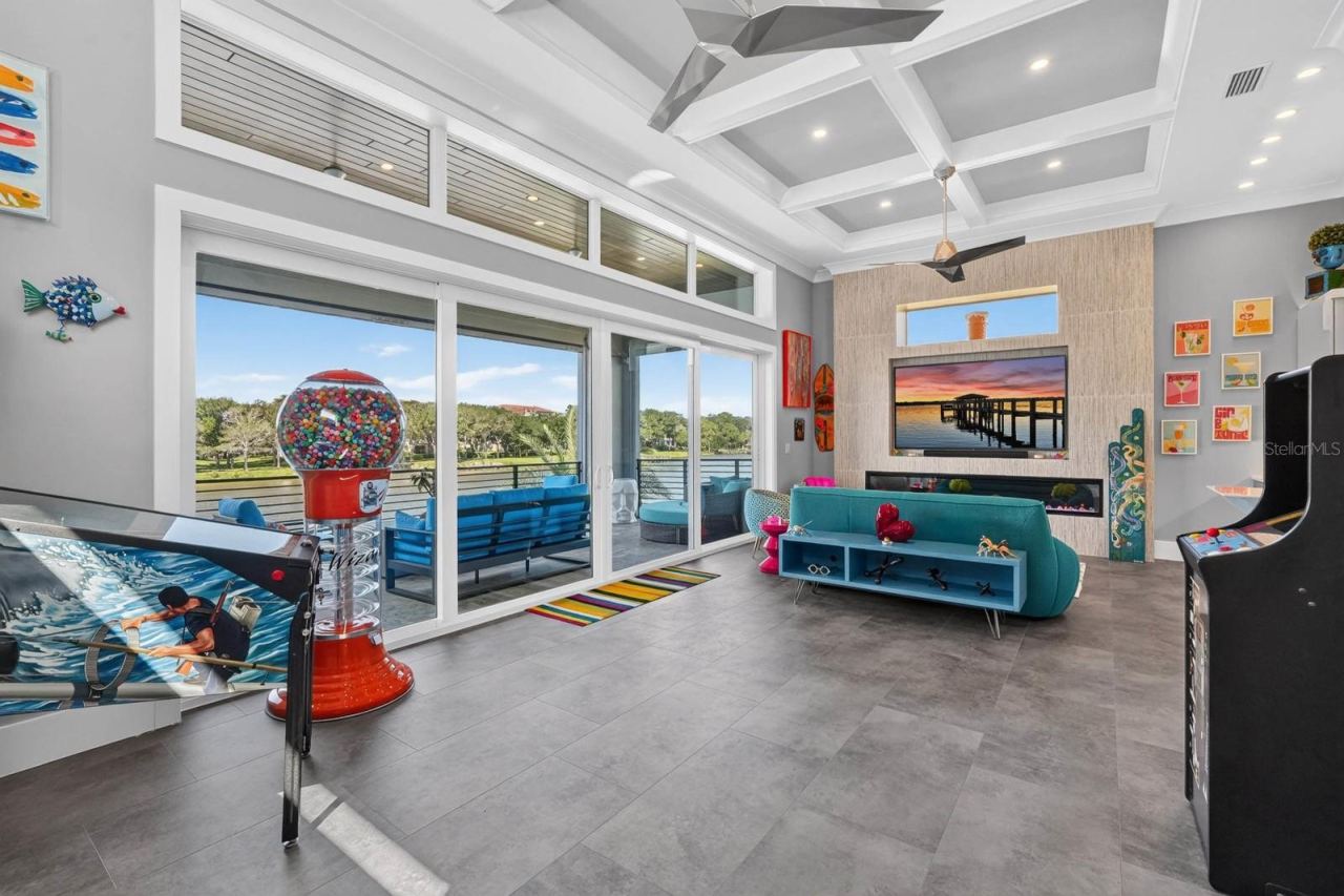 Photo 8 of 20: Who says the fun has to stay downstairs? A dedicated second-floor gathering space with fireplace, wet bar, game area and expansive balcony overlooking the Intracoastal.