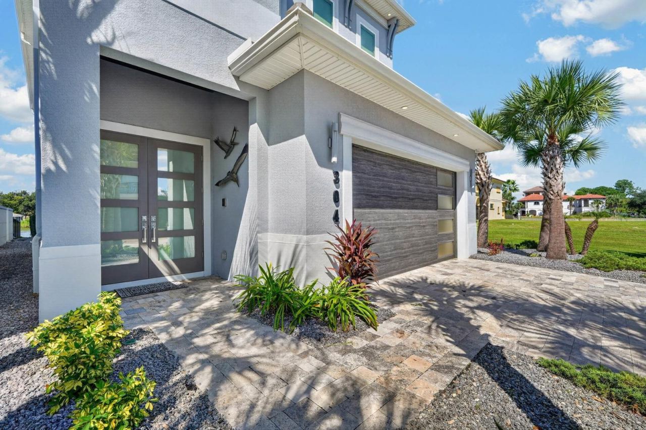 Photo 13 of 20: Easy waterfront living. HOA-maintained lawn care and seawall add to the lock-and-leave lifestyle.