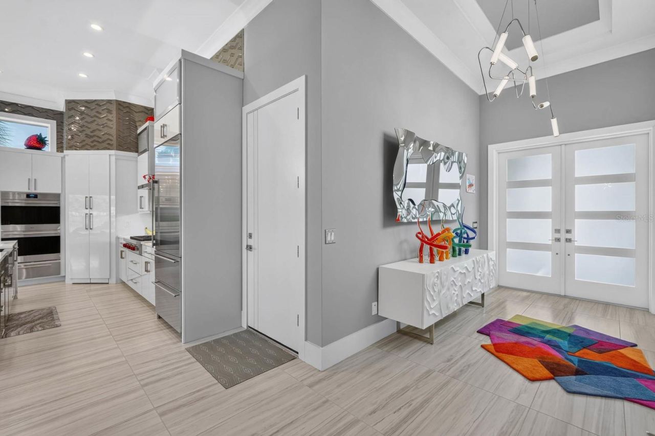 Photo 15 of 20: The details start the moment you walk in. Soaring ceilings, smooth-finish walls, designer lighting and custom solid-wood doors set the tone.