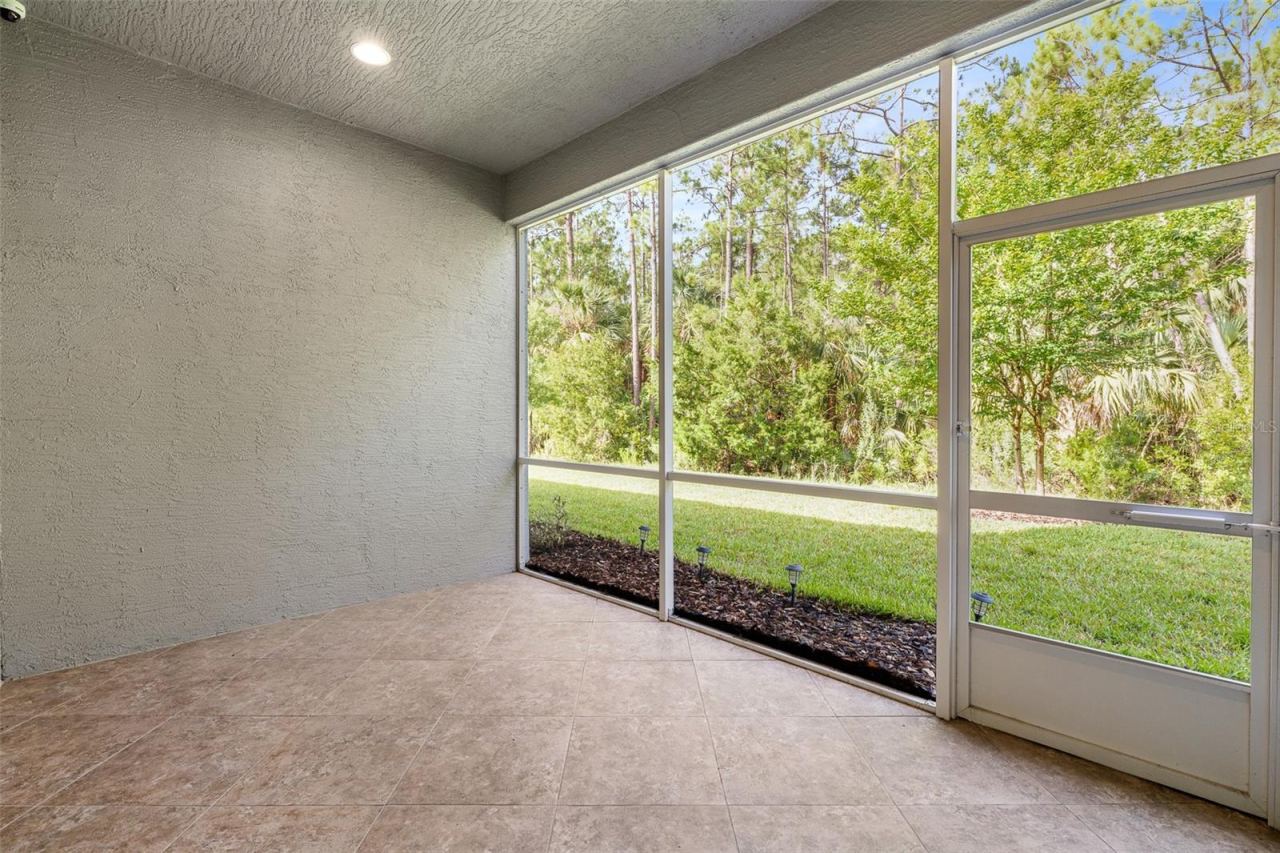 Photo 4 of 20: Covered & Screened Lanai w/Preserve Views