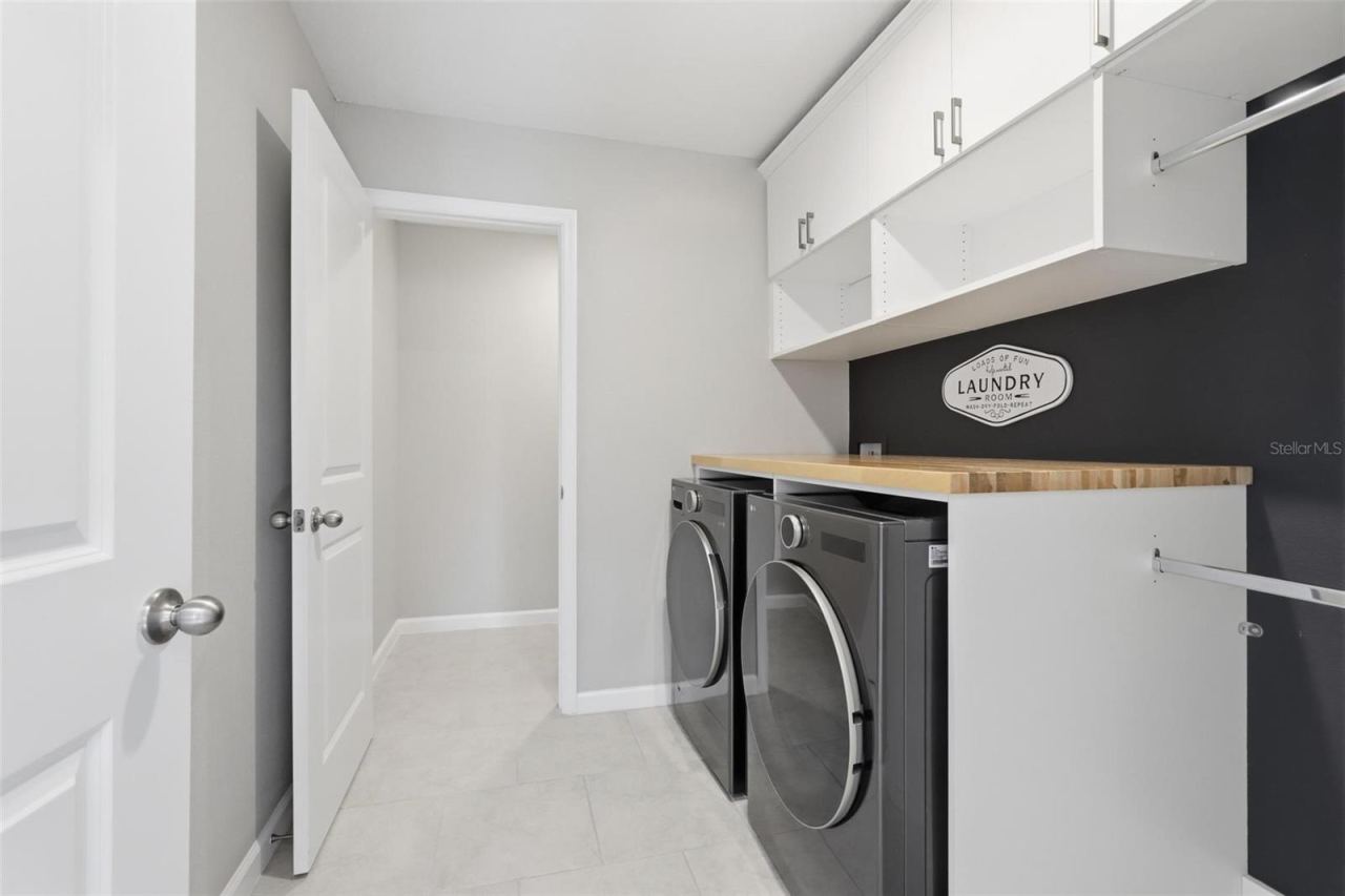 Photo 11 of 20: Laundry room upstairs with custom cabinetry
