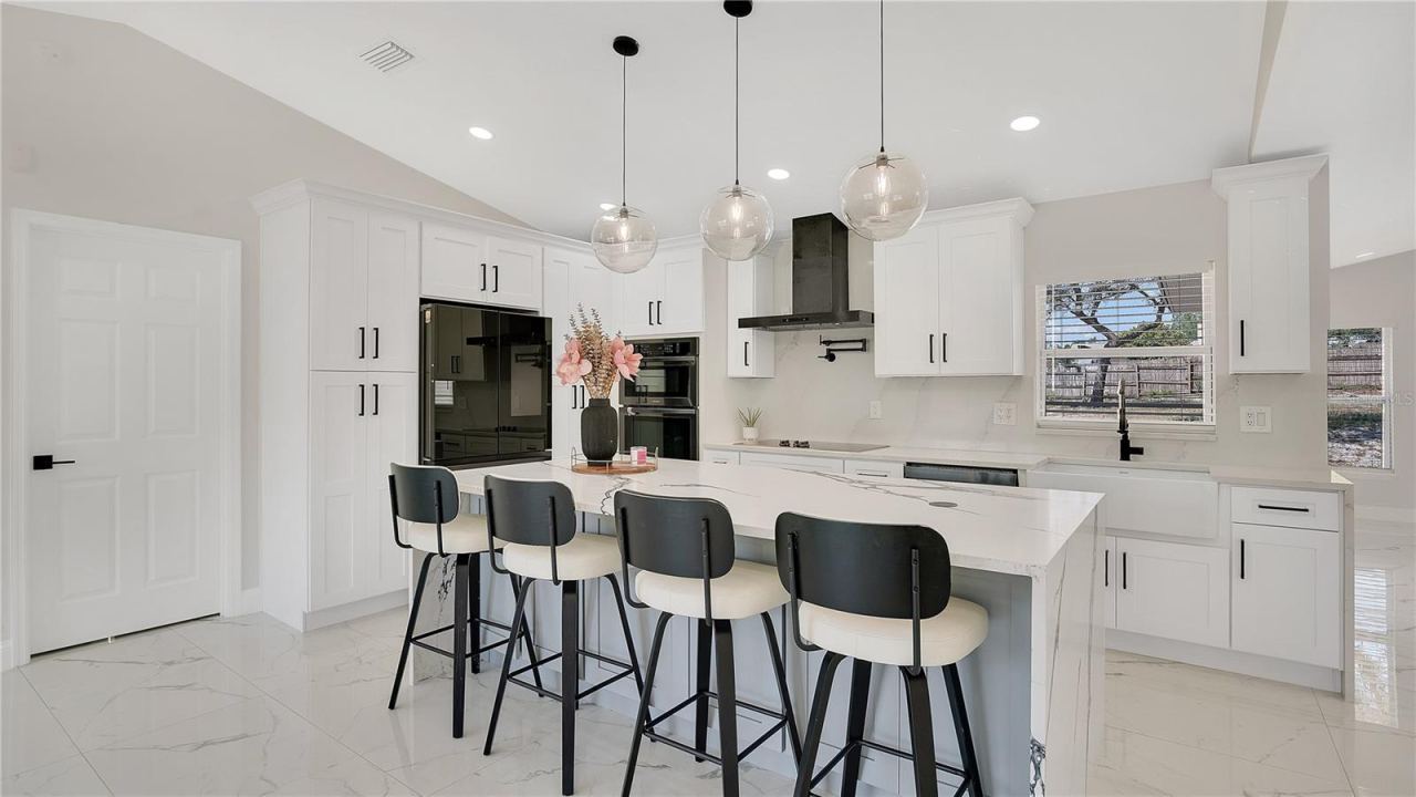 Photo 11 of 20: Kitchen with center island and bar seating