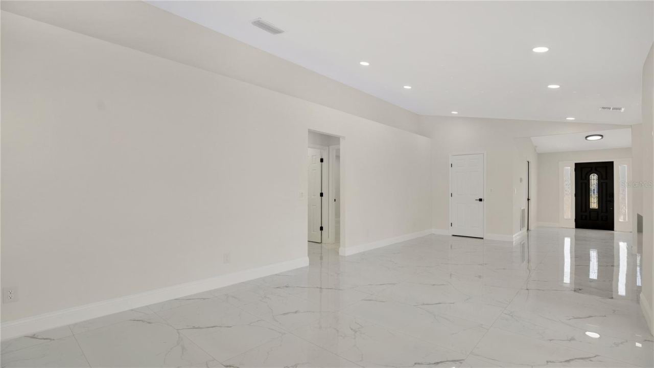 Photo 6 of 20: Entry foyer with tile flooring