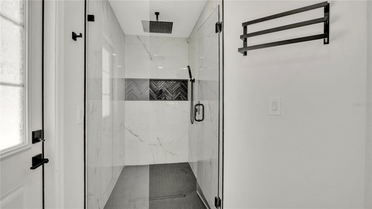 Photo 19 of 20: Primary bath with tiled walk-in shower