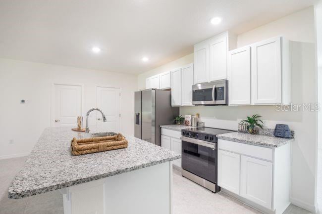 Photo 5 of 20: Model home - actual features may vary.
