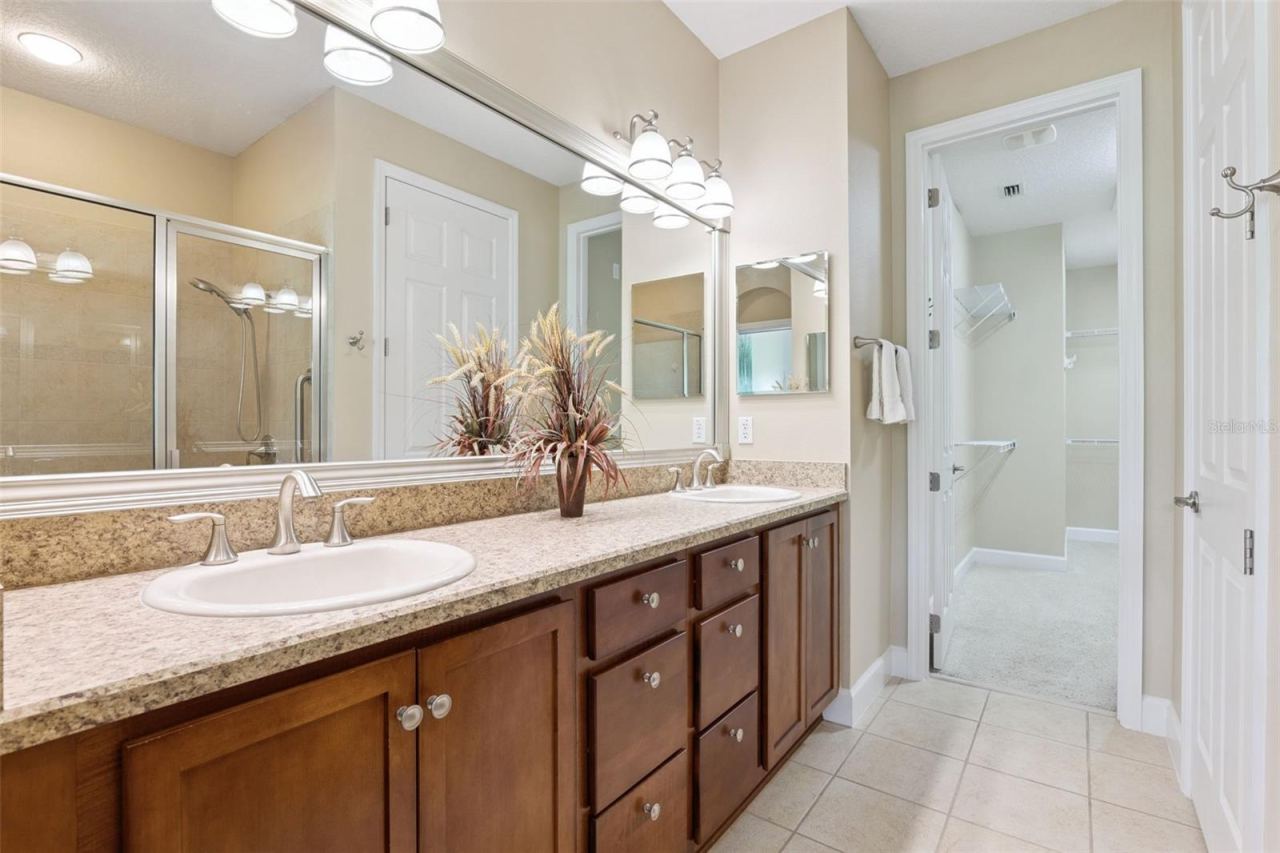Photo 20 of 20: Primary Bathroom vanity w/ framed mirror & dual sinks