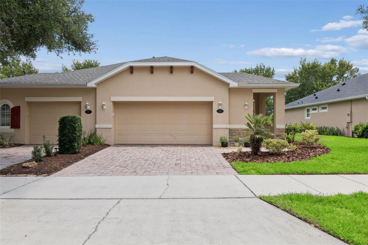 Photo 1 of 20: Exterior front of the Villa w/ a 2-car garage