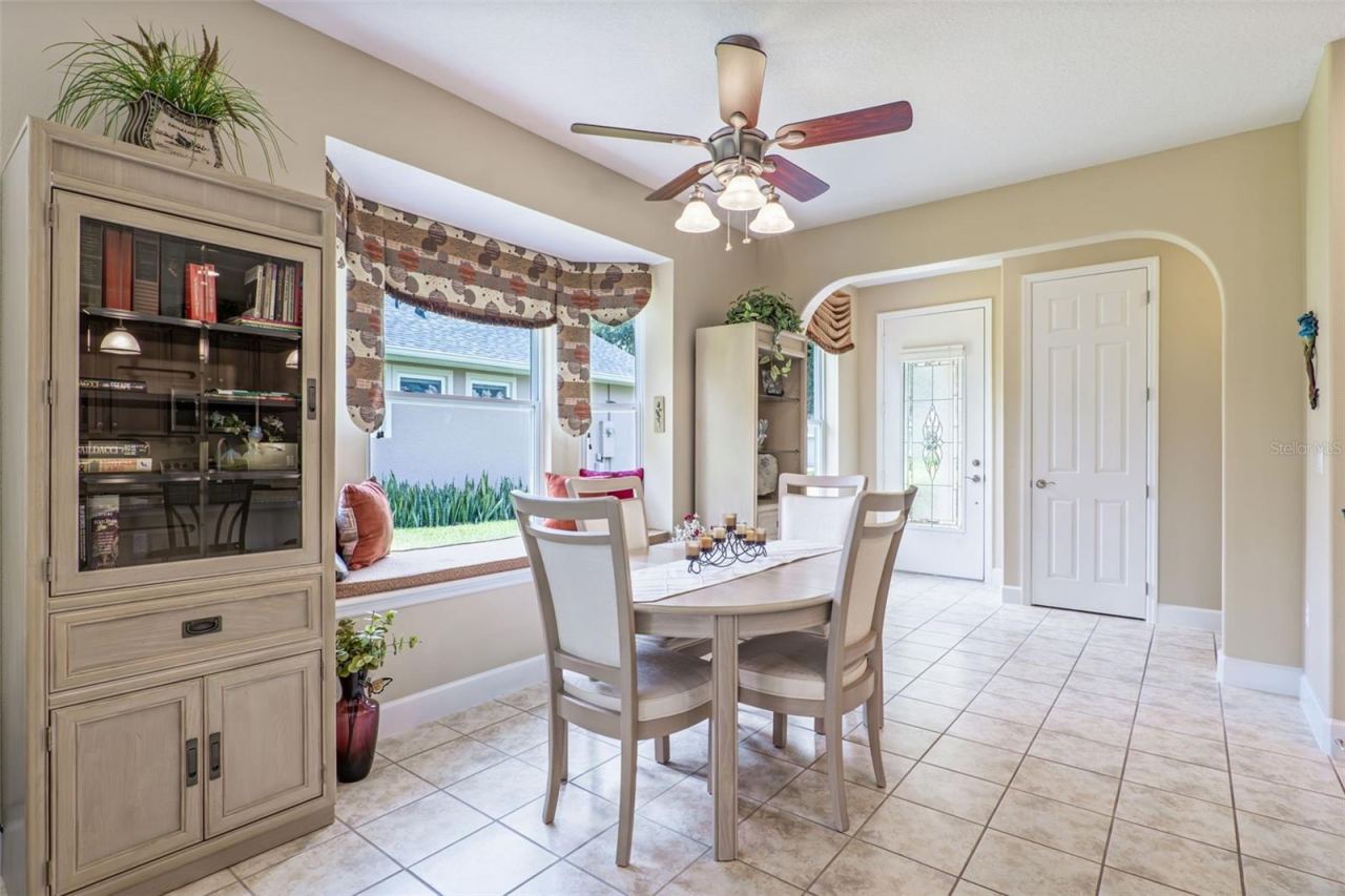 Photo 6 of 20: Dining Room w/ a window seat & a ceiling fan