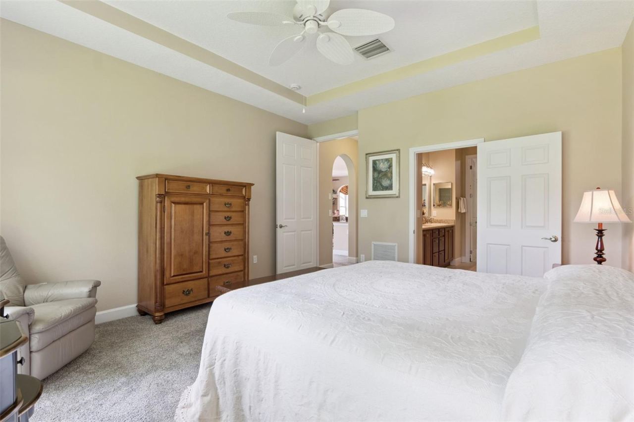 Photo 18 of 20: Primary Bedroom w/ a door to the en suite bathroom