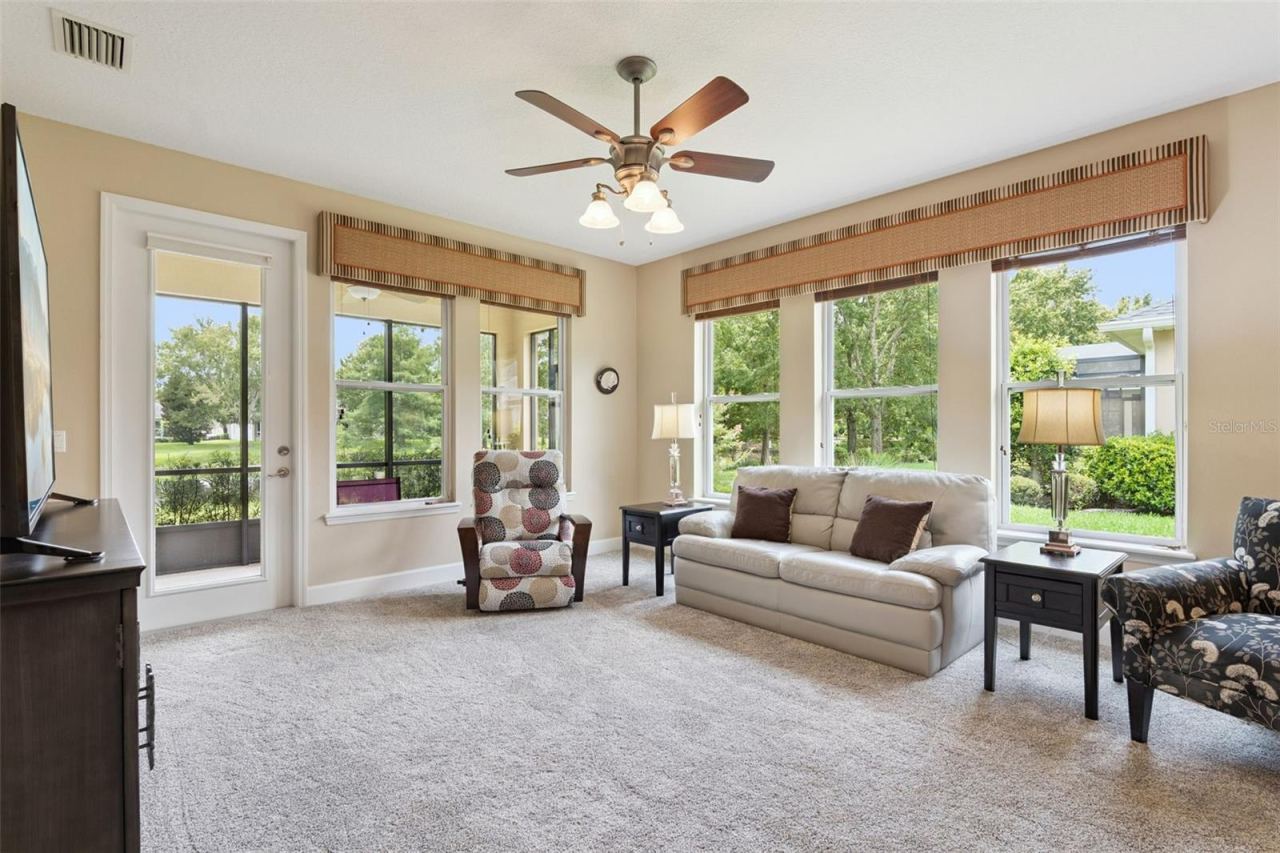 Photo 12 of 20: Great Room w/ a French door that leads out to the screen enclosed covered lanai