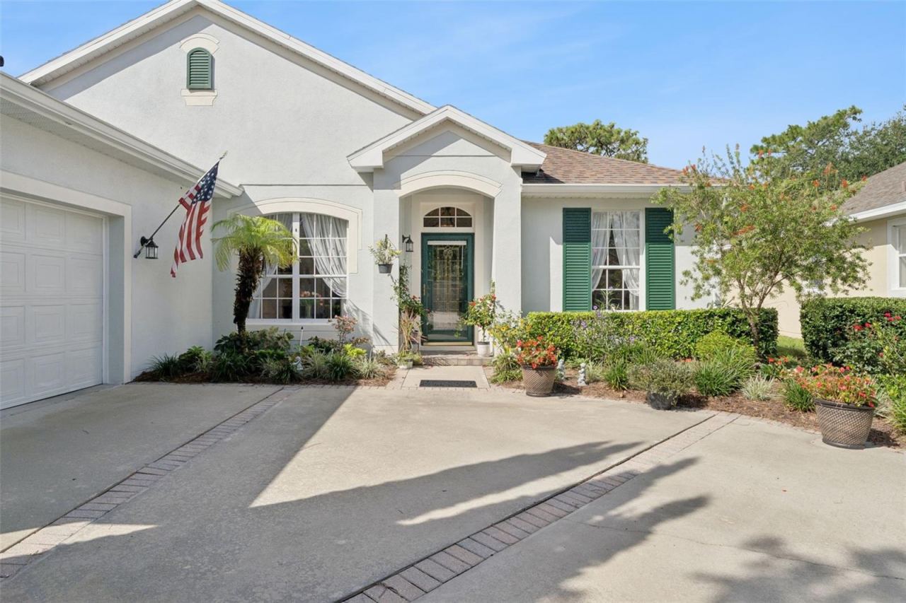 Photo 2 of 20: Exterior front of the home w/ a leaded glass front door & storm door