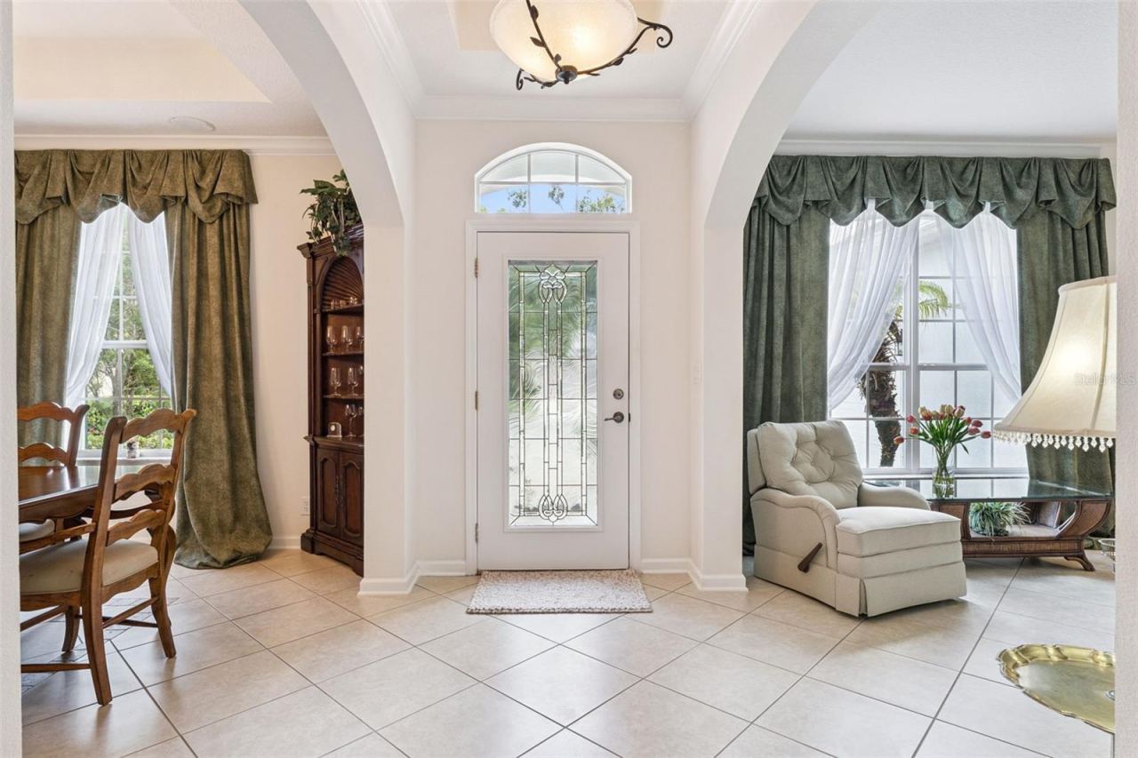 Photo 3 of 20: Foyer entryway w/ leaded glass front door, tray ceiling & crown molding