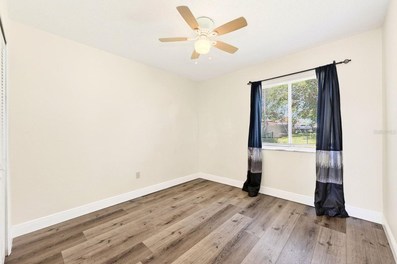 Photo 13 of 20: Bedroom 2 provides the ideal space for visitors or can be customized as a home office or hobby room.