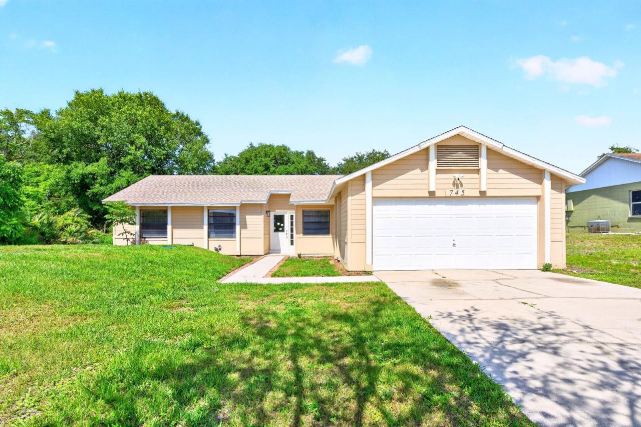 Photo 1 of 20: Welcome to this well-cared-for and MOVE-IN READY 3-bedroom, 2-bath home in Deltona Lakes, where thoughtful updates, a spacious layout, and the freedom of NO HOA create the perfect place to call home.