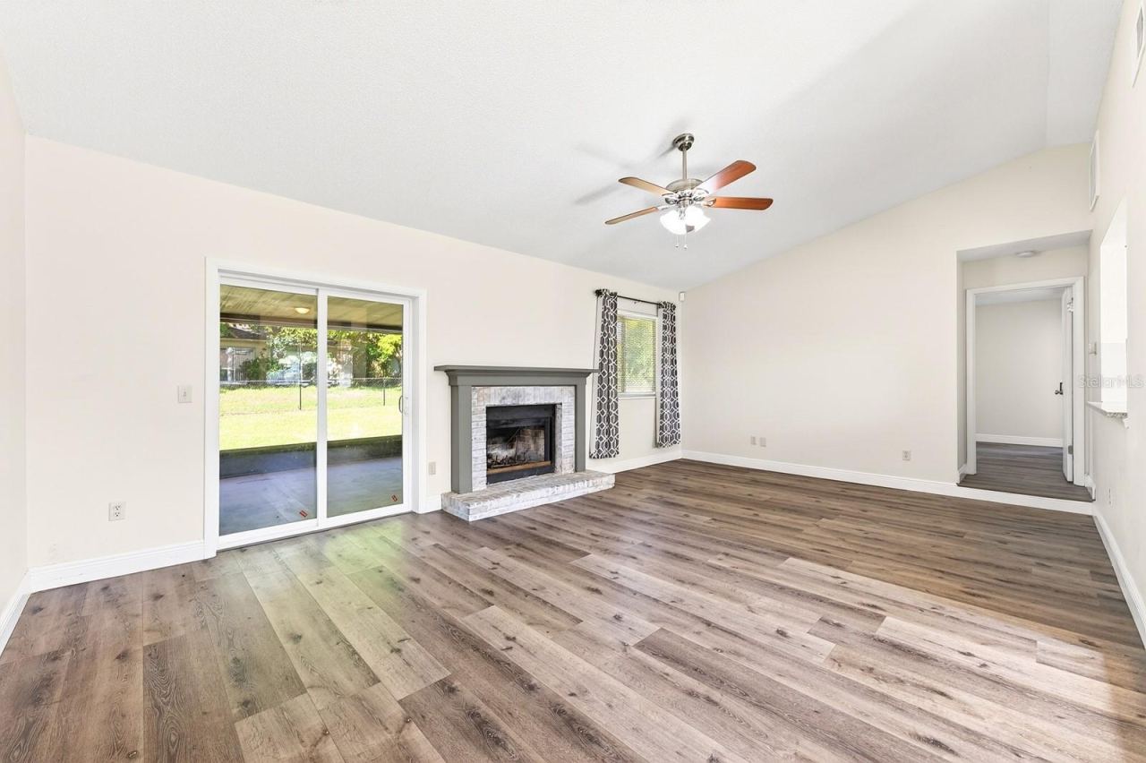 Photo 4 of 20: Sliding glass doors lead to the back patio, seamlessly connecting indoor and outdoor living.