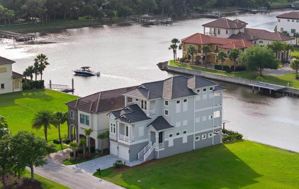 Photo 1 of 20: Welcome to 18 Spinaker Circle, where waterfront living and the relaxed elegance of Yacht Harbor Village create an unforgettable coastal lifestyle.