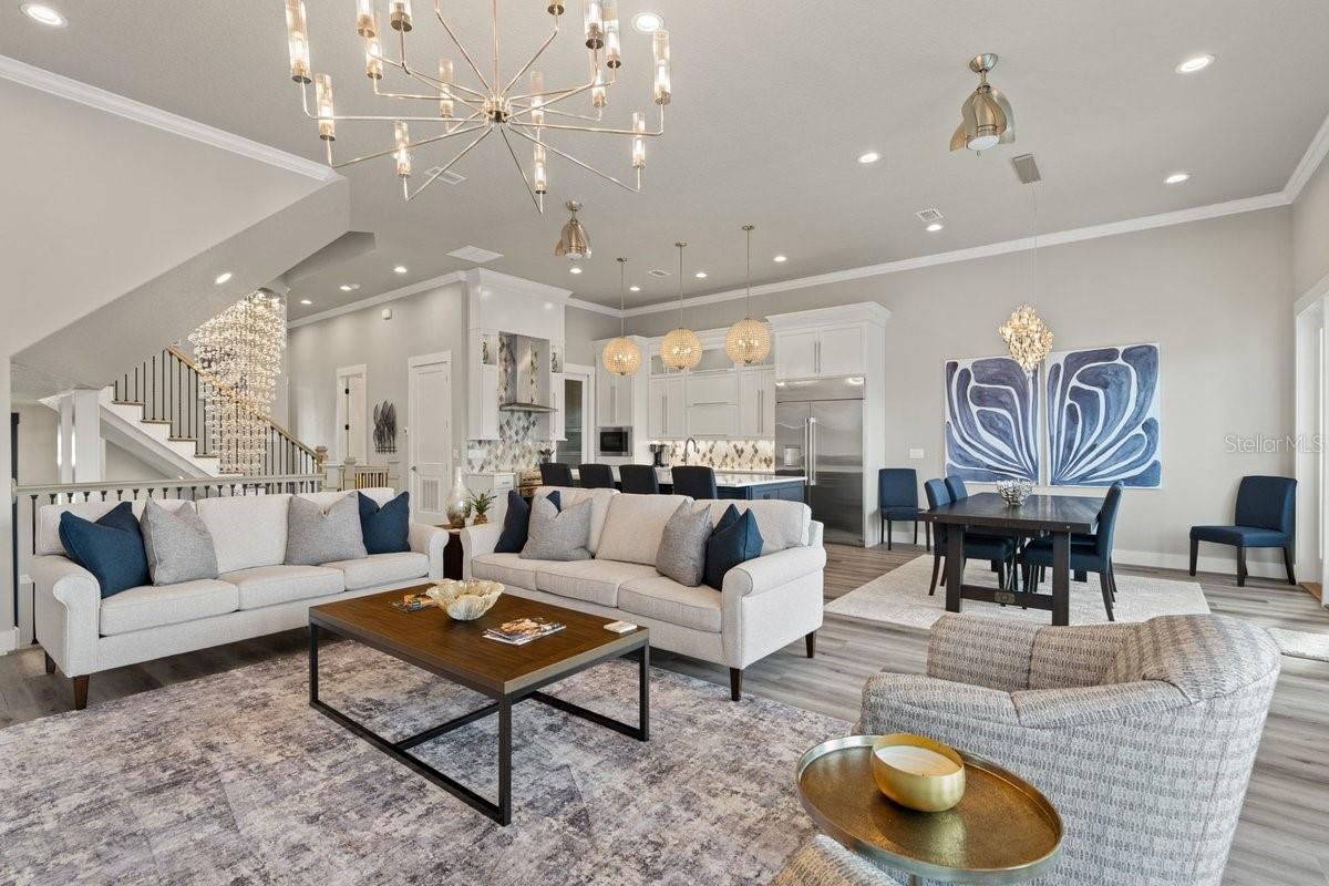 Photo 13 of 20: Striking designer finishes, dramatic lighting, and expansive open living spaces create an atmosphere that feels both luxurious and instantly welcoming — a home made for unforgettable moments with family and friends.