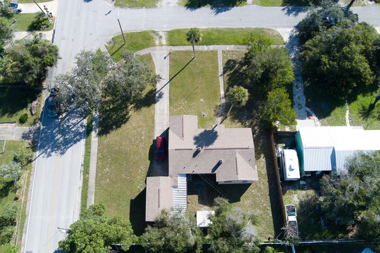 Photo 17 of 20: Aerial view of roof and property